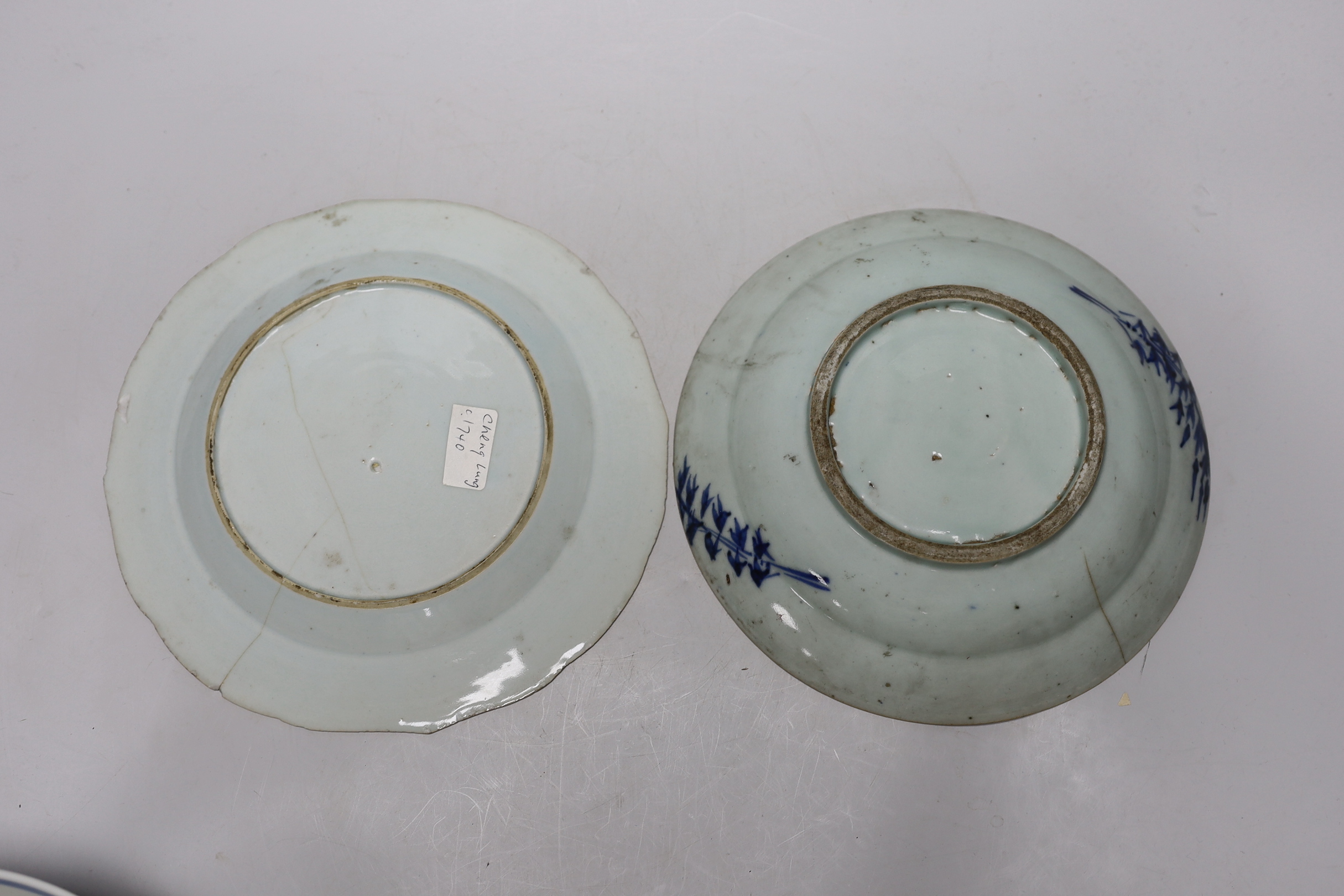 A Chinese blue and white ‘boys’ bowl and two blue and white flower plates, largest 24cm diameter